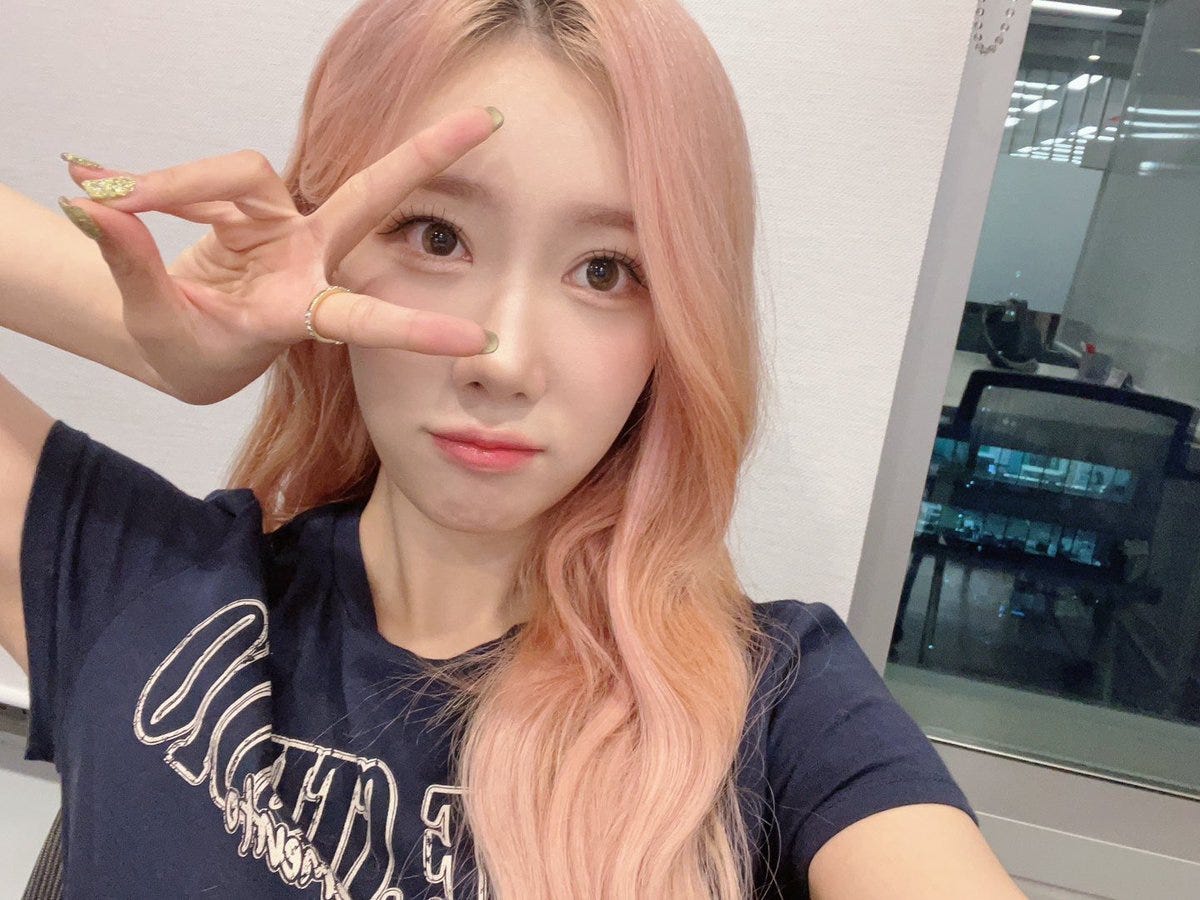 Selfie from Handong with pink hair and a blue shirt