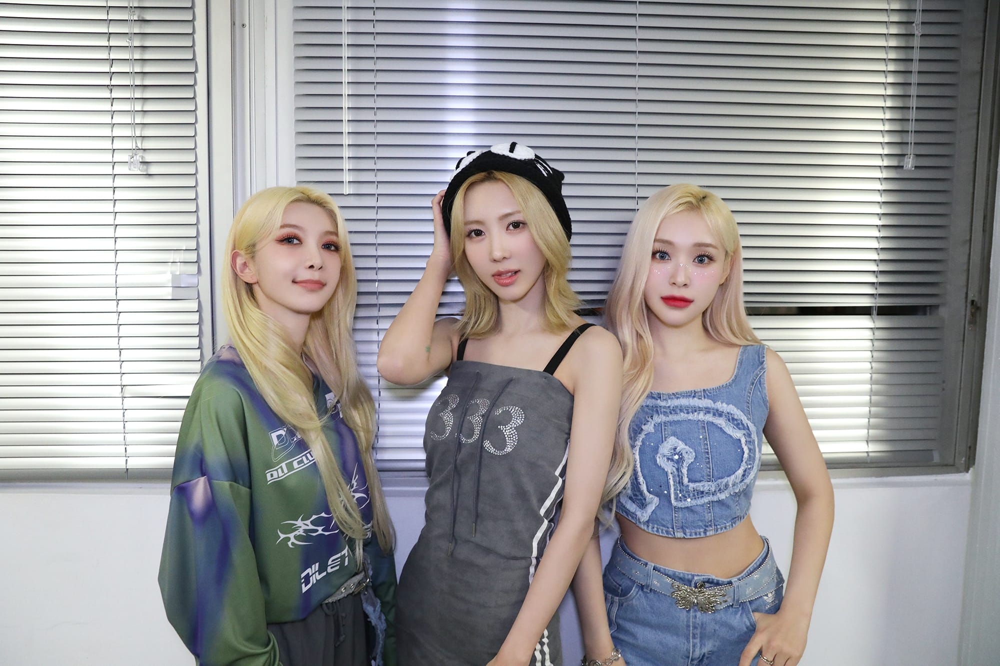 Yoohyeon, Dami and Gahyun smile for the camera posing backstage in Offenbach, Germany