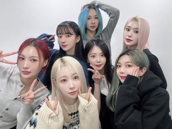 Group picture of Dreamcatcher's 7 members against a white background dressed casually.