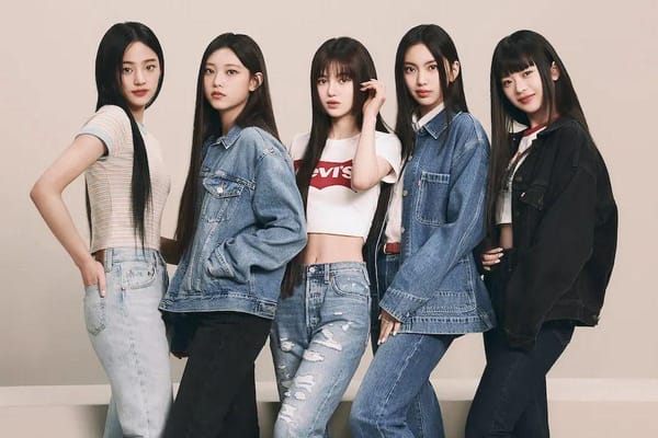 NewJeans' five members posing for Levi's for their shoot announcing them as brand ambassadors.