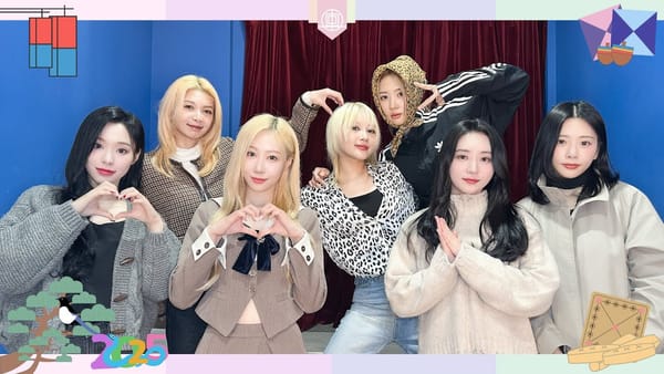 Dreamcatcher smiling and forming hearts to wish fans a Happy Lunar New Year